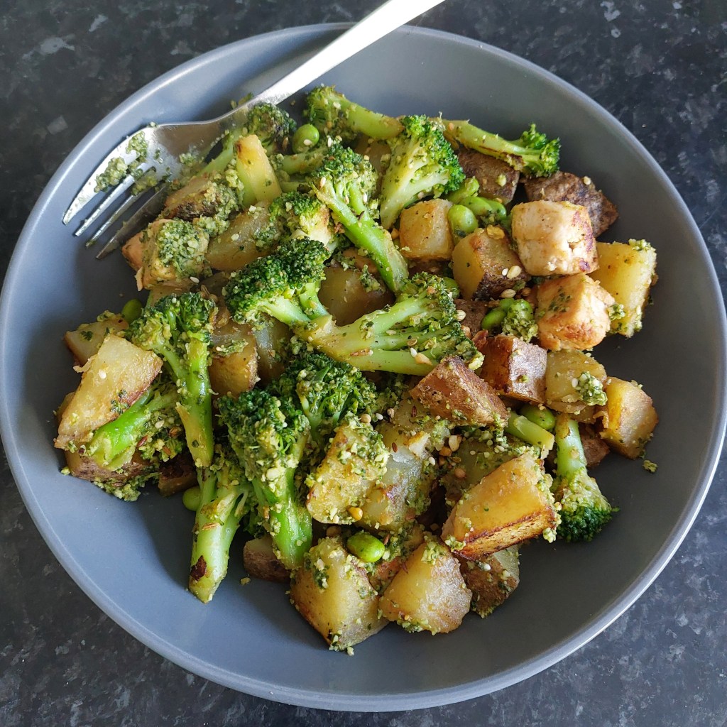Photo of fried potatoes, broccoli, soybeans and Quorn pieces in grey bowl.