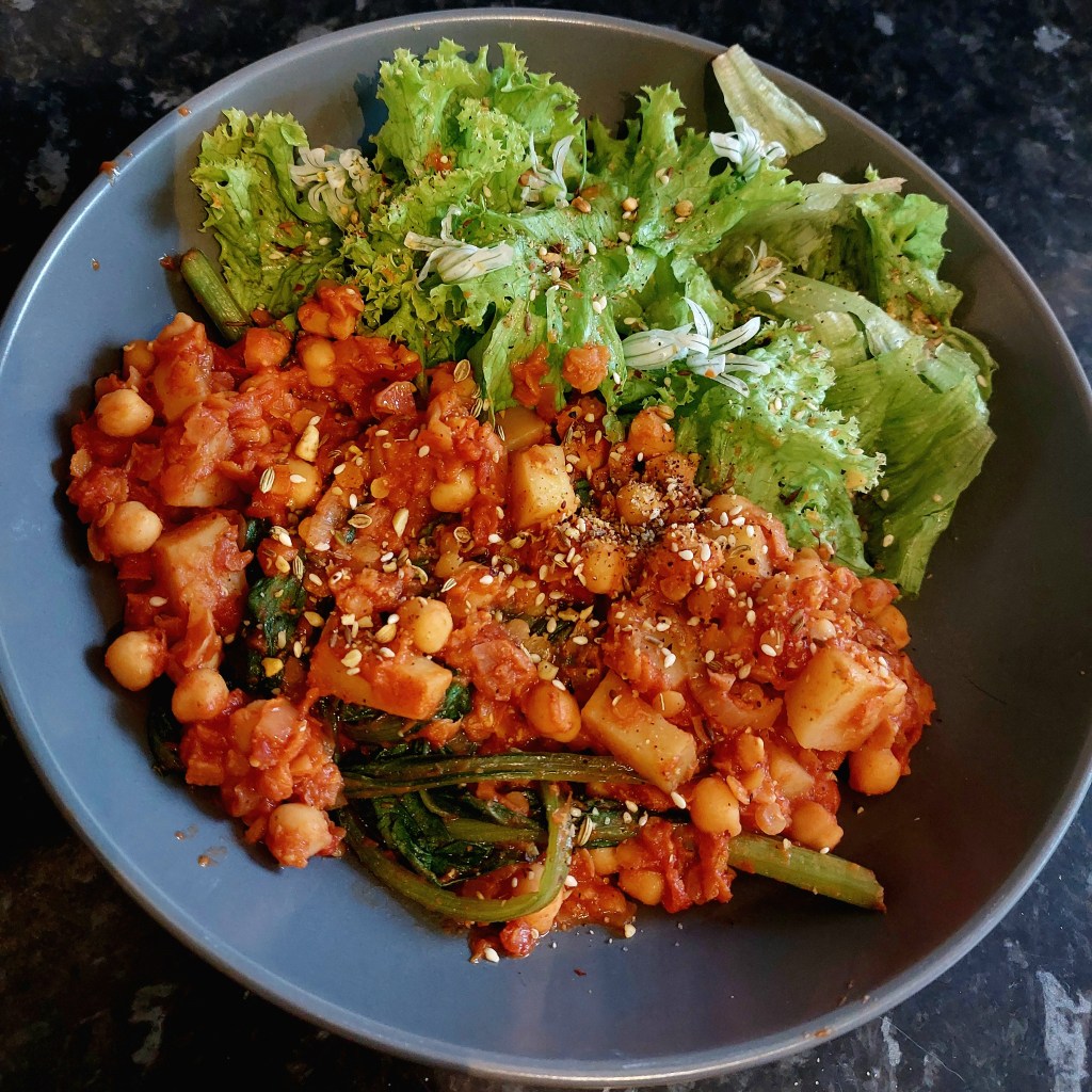 Photo of vegetable curry and lettuce.